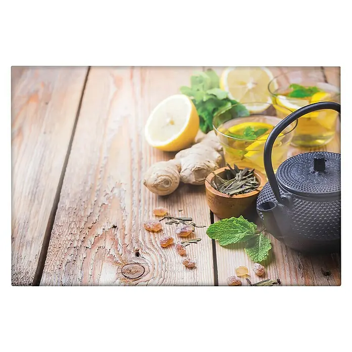 CUCINE Küchenrückwand - Ginger Tea, 60 x 40 cm, Stärke: 6 mm, Einscheibensicherheitsglas (ESG) - Nahaufnahme eines Tee-Sets mit Zitrone, Ingwer und Minze auf einem Holztisch. Ideal für entspannende Teestunden und gesundheitliche Vorteile.