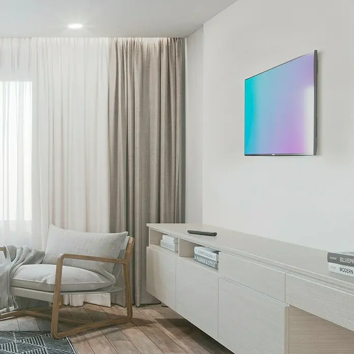 Hama TV-Wandhalterung starr - Passend für: Bildschirmdiagonale 32 - 75″, 81 - 191 cm, Belastbarkeit: 40 kg, Wandabstand: 2,5 cm - Elegantes Wohnzimmer mit modernem TV-Gerät an der Wand, stilvollem Schrank und einem gemütlichen Sessel für entspannte Stunden.