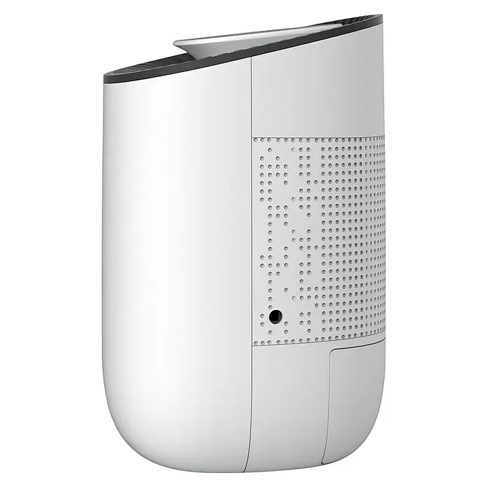 Purline Elektro-Luftentfeuchter Dryos 1 - 23 W, L x B x H: 14,6 x 14,6 x 22,5 cm, Weiß - Weißes vertikales Elektronikgerät mit perforiertem Gitter und schwarzen Akzenten oben.