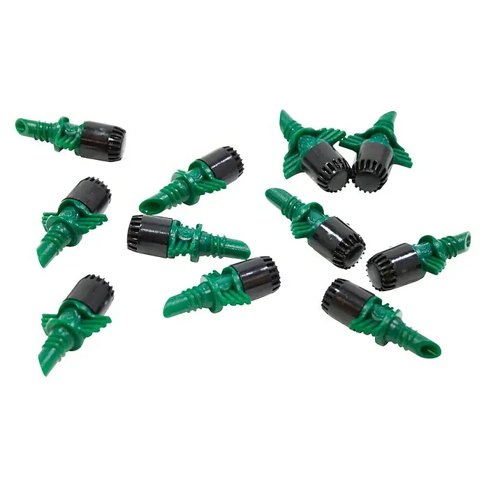 Tobera pulverizadora microdifusora 360º 60 L/H - 10 ud., Formas de riego: 360° - Una imagen de cerca de varios goteros de riego por goteo verdes y negros esparcidos sobre una superficie blanca.