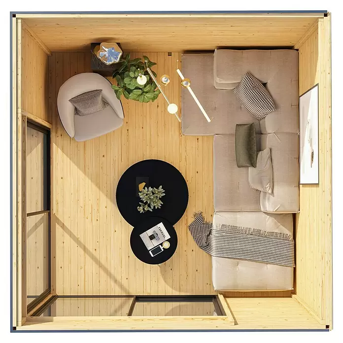Karibu Gartenhaus Dice 3 - Außenmaß inkl. Dachüberstand (B x T): 308 x 3.082 cm, Holz, Naturbelassen - Draufsicht auf ein kleines, helles Holzkabinen-Interieur, eingerichtet als gemütlicher Wohnbereich mit Sofa und Sessel.