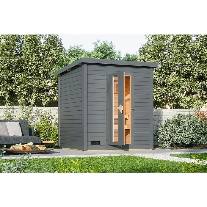 Karibu Saunahaus Hytti - Ohne Ofen, Terragrau, L x B x H: 196 x 196 x 228 cm - Ein modernes Saunahaus im Garten, das durch seine graue Farbe und die geöffneten Glastüren einen einladenden Eindruck macht.
