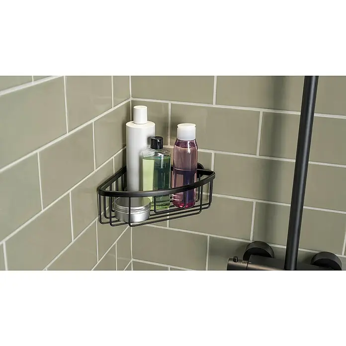 Tesa Aluxx Eckduschkorb - 1-stöckig, Schwarz, Eloxiert - Schwarzes Eckregal mit Shampoo und Duschgel an der Wand. Die Aufbewahrung im Badezimmer ist ordentlich und spart Platz durch die Eckmontage.