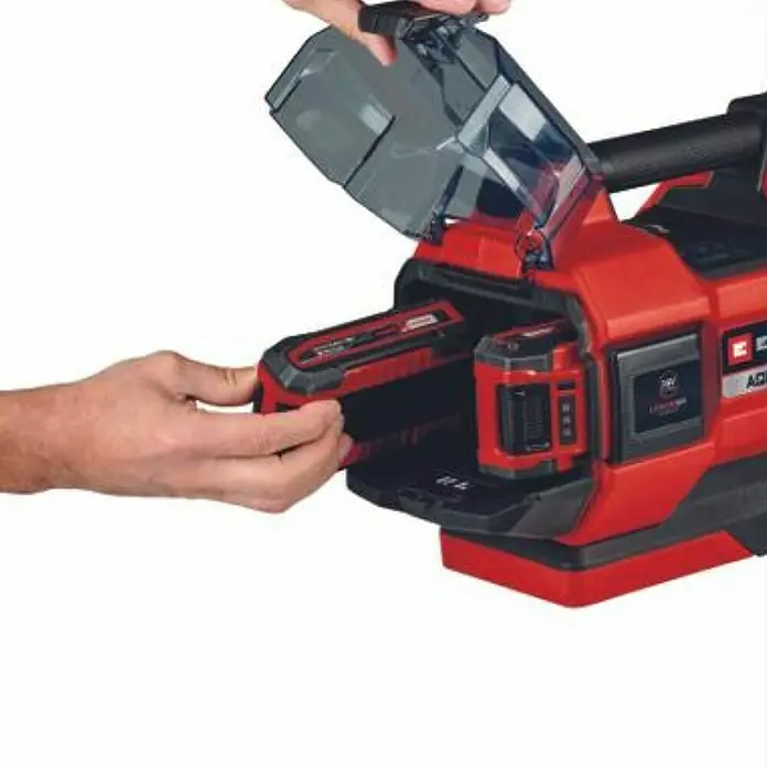 Einhell PXC 18V Bomba de agua para jardín de batería 36/38 F LED Automatic - 18 V, Iones de litio, Sin batería, Capacidad de bombeo máx.: 3.800 l/h - Un dispositivo Einhell rojo con una batería que se inserta con una mano y una tapa protectora transparente.