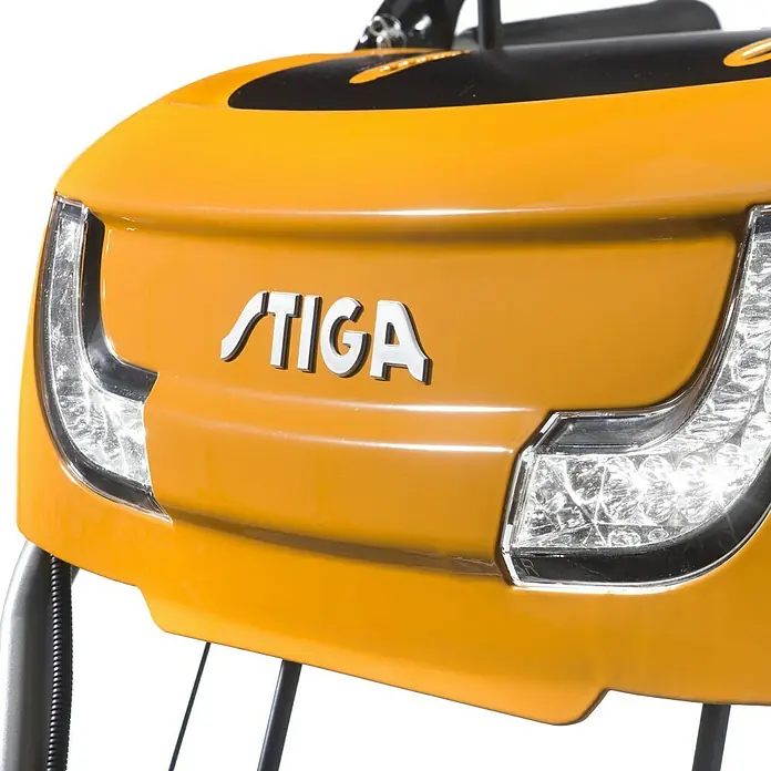 Stiga Kehrmaschine SWS 800 GE - 4,4 kW, Arbeitsbreite: 80 cm - Nahaufnahme eines gelben STIGA-Robotermähers mit LED-Leuchten und dem STIGA-Logo, der für effiziente Rasenpflege steht.