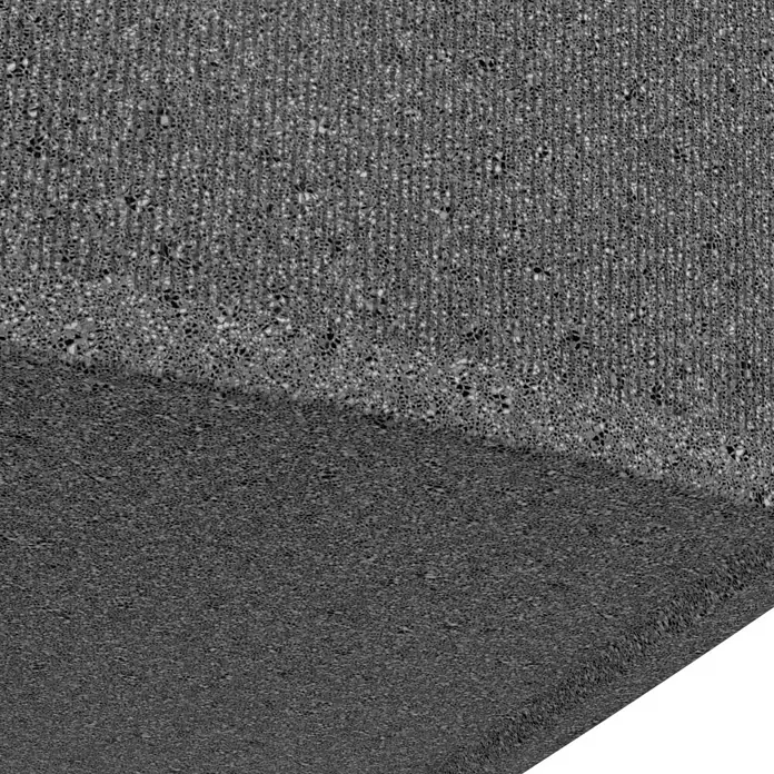 Arves Regenspeicher Boxy - 720 l, Granitkörnung, 1 Stk. - Detailaufnahme einer rauen, grauen Betonoberfläche. Die Textur zeigt eine Mischung aus feinen und groben Elementen.