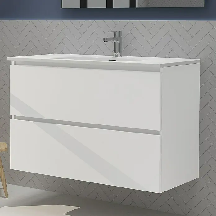 Artysan Conjunto de mueble de baño Harmony - Ancho: 100 cm, Blanco, 3 pzs. - La imagen muestra un moderno mueble de baño blanco con dos cajones, montado en una pared gris con un patrón de espiga.