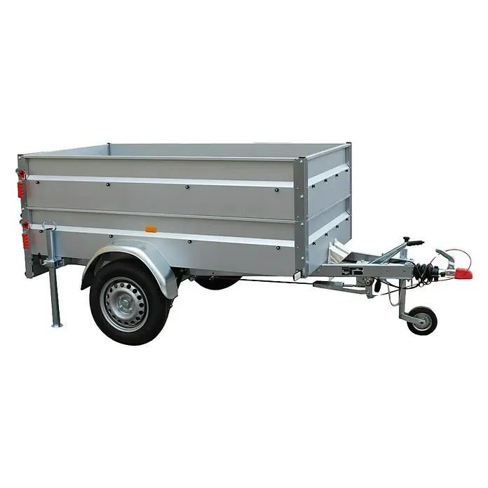 Stema Anhänger BASIC 1000 - Nutzlast: 789 kg, Einachser, 201 x 108 x 69 cm mit Bordwandaufsatz, Gebremst - Silberner Anhänger mit Rädern und Deichsel vor schwarzem Hintergrund.