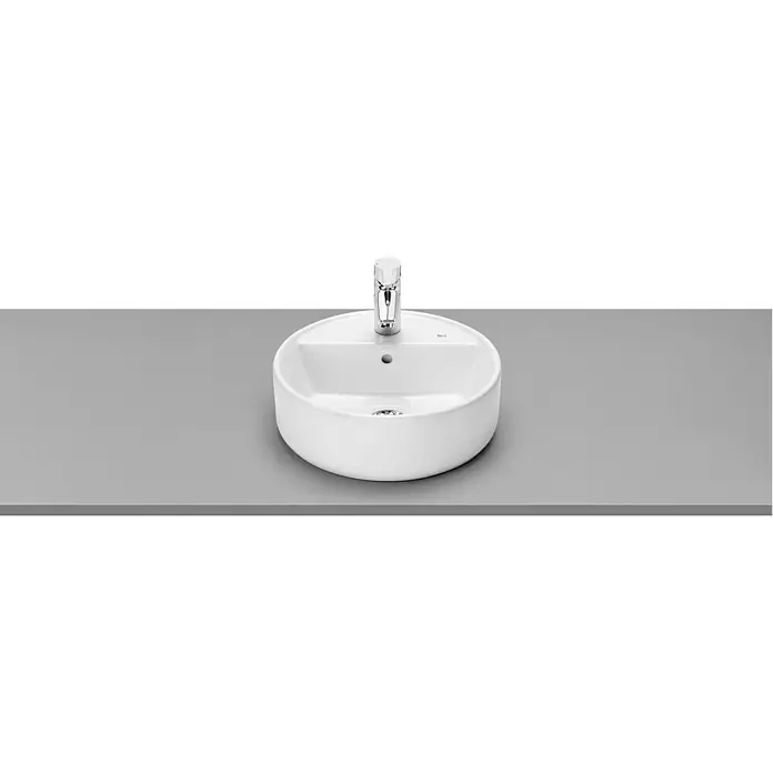 Roca Lavabo con repisa Domus - 40 x 40 cm, Orificios para grifo: Medio, Con desbordamiento, Blanco - Lavabo redondo con grifo brillante sobre superficie gris. Diseño moderno para baños y aseos de cortesía.
