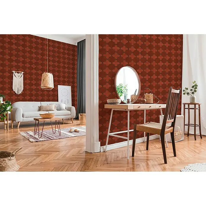 A.S. Création New Walls Vliestapete Stern Fliese - Rot, Fliesenoptik, 10,05 x 0,53 m - Das Foto zeigt ein Zimmer mit einer Wand mit einem geometrischen Muster in warmen Rottönen, das eine besondere Atmosphäre erzeugt.