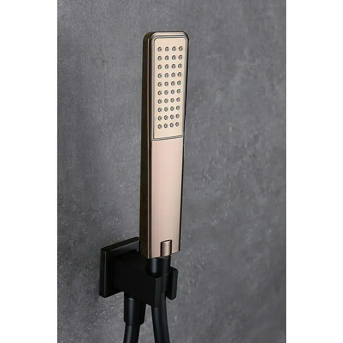 Imex Suecia Sistema de ducha empotrado - Con grifo monomando, Negro/Oro rosa - Imagen de una moderna ducha de mano rectangular con aspecto dorado y soporte negro sobre pared gris.