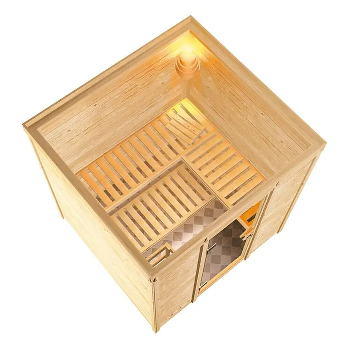 Karibu Elementsauna Mojave - Mit 9 kW Ofen mit externer Steuerung, Ohne Dachkranz, Materialspezifizierung Tür: Ganzglas Bronze, L x B x H: 196 x 196 x 192 cm - Innenansicht einer modernen Holzsauna mit Sitzbänken und Fliesenboden, beleuchtet durch eine Lampe.