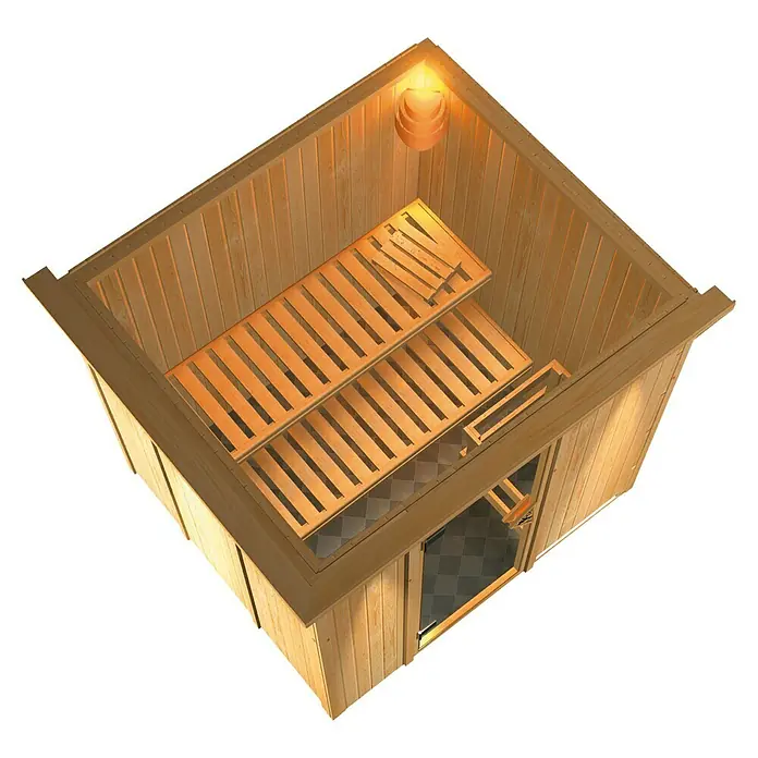 Karibu Elementsauna Daria - Mit 3,6 kW Ofen mit externer Steuerung, Mit Dachkranz und Beleuchtung, L x B x H: 210 x 184 x 192 cm - Blick von oben auf eine Holzsauna mit Bänken und einer Lampe. Die Sauna hat eine Tür und ein schachbrettartiges Fliesenmuster.