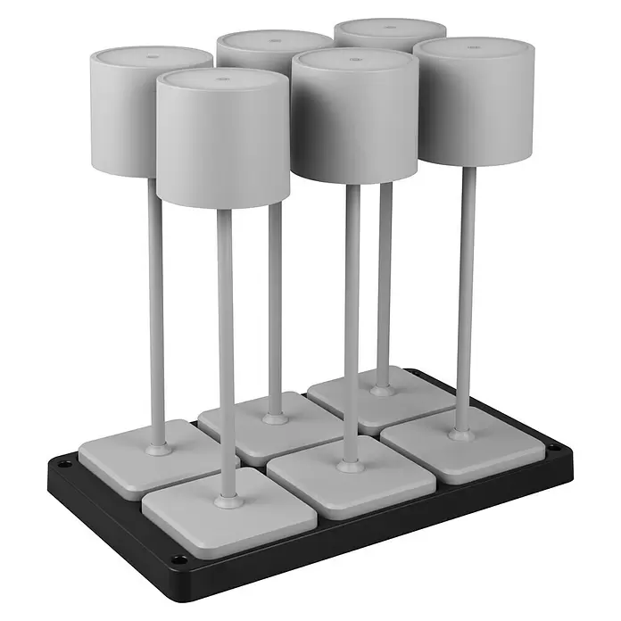 Reality Leuchten Akku-Tischleuchte FERNANDEZ + Ladestation - 6 W, L x B x H: 26 x 42,6 x 40 cm, Grau, Mehrfarbig - Sechs weiße Zylinder mit grauen Ständern und weißen Quadratbasen in schwarzer Ablage.