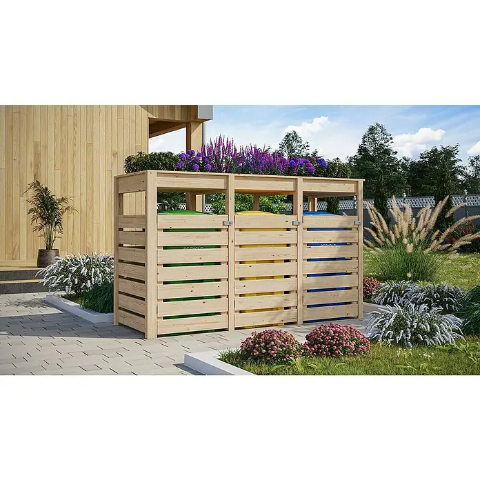 Karibu Mülltonnenverkleidung mit integriertem Hochbeet - Holz, Naturbelassen, Geeignet für Anzahl Mülltonnen: 3 Stk. - Eine hölzerne Mülltonnenbox mit drei Fächern für Wertstofftrennung im Garten, bepflanzt mit lila und grünen Pflanzen.
