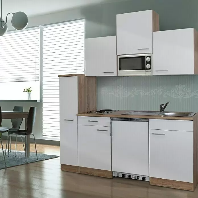 Respekta Cocina compacta Luis - Ancho: 180 cm, Blanco, Color del cuerpo: Blanco, Placa de cocina doble, frigorífico y microondas - Cocina compacta con armarios blancos y detalles de madera clara, incluyendo microondas, fogones, fregadero y nevera integrada.