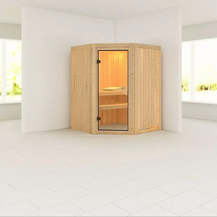 Karibu Elementsauna Larin - Ohne Ofen, Ohne Dachkranz, L x B x H: 151 x 151 x 192 cm - Innenaufnahme einer Ecksauna aus hellem Holz mit Glastür und Bänken in einem hellen Raum.