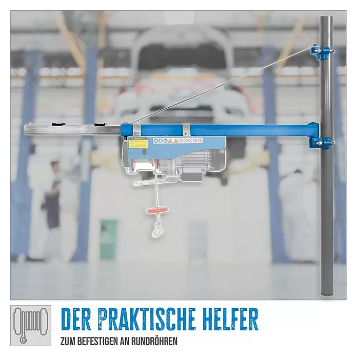 Güde Schwenkarm 1200 - Tragkraft: 600 kg - Ein blauer Elektroseilzug, an einer Metallstange in einer Werkstatt montiert, zum Befestigen an Rundrohren.