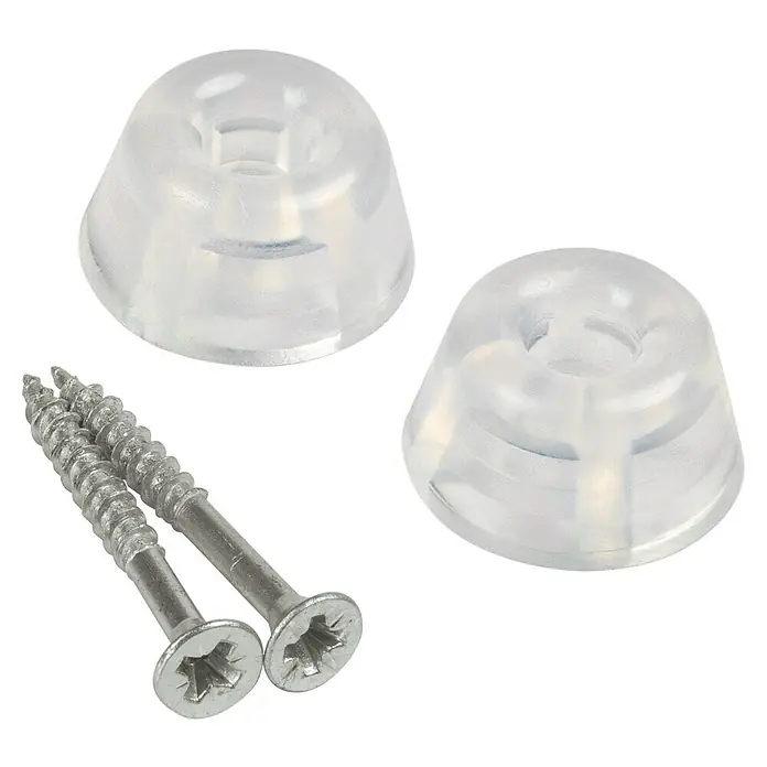 Fix-o-moll Protección de bordes - Plástico, Transparente - Dos patas de muebles transparentes y dos tornillos plateados aislados sobre un fondo negro.