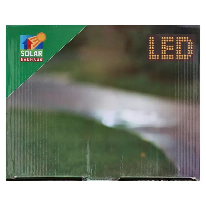 BAUHAUS Solar-Erdspieß Flame - 0,06 W, L x B x H: 38 x 38 x 151 cm, Schwarz/Gold, IP44 - Grüne Solar Bauhaus LED Produktverpackung mit Haus- und Sonnenlogo.