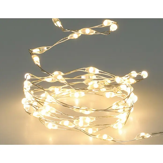 LED-Lichterdraht - Innen, Lichtfarbe: Warmweiß, 132 Stk., Batteriebetrieben - Nahaufnahme einer Lichterkette mit warmweißem Licht, die sich in einem sanften Spiralmuster auf einer hellen Oberfläche windet.