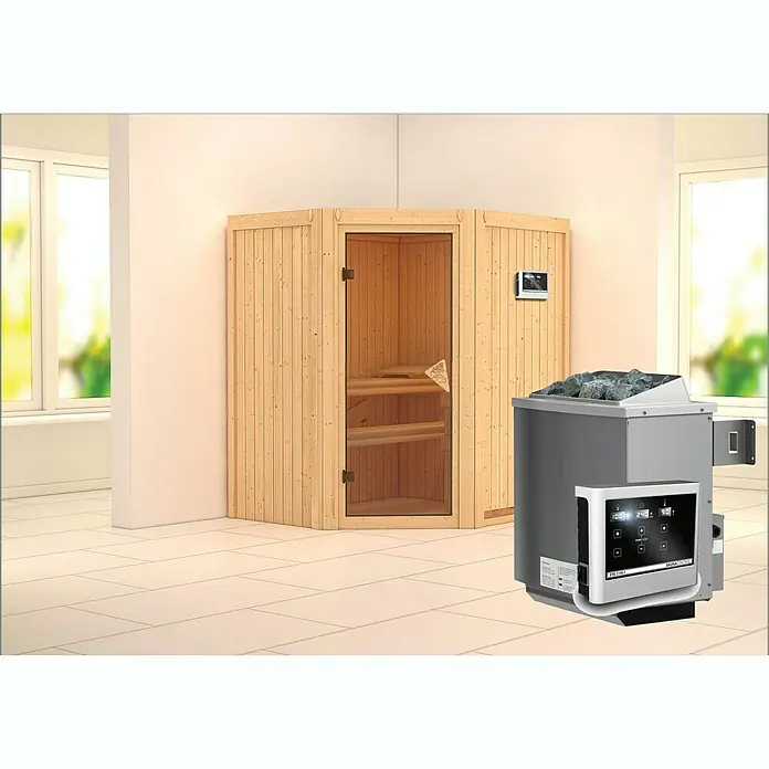 Karibu Elementsauna Taurin - Mit 9 kW Ofen mit externer Steuerung, Ohne Dachkranz, L x B x H: 170 x 151 x 192 cm - Eine Ecksauna mit Holzbänken und einer Glastür, neben einem Saunaofen mit Steinen und Bedienfeld. Ideal für Ihr Wellnesserlebnis.