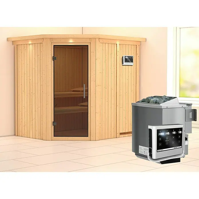 Karibu Elementsauna Siirin - Mit 9 kW Bio-Ofen mit externer Steuerung, Mit Dachkranz und Beleuchtung, Materialspezifizierung Tür: Ganzglas Graphit, L x B x H: 210 x 184 x 192 cm - Eine Innensauna mit Holzwänden und Glastür, neben der sich ein Saunaofen mit Steinen und Steuerung befindet.