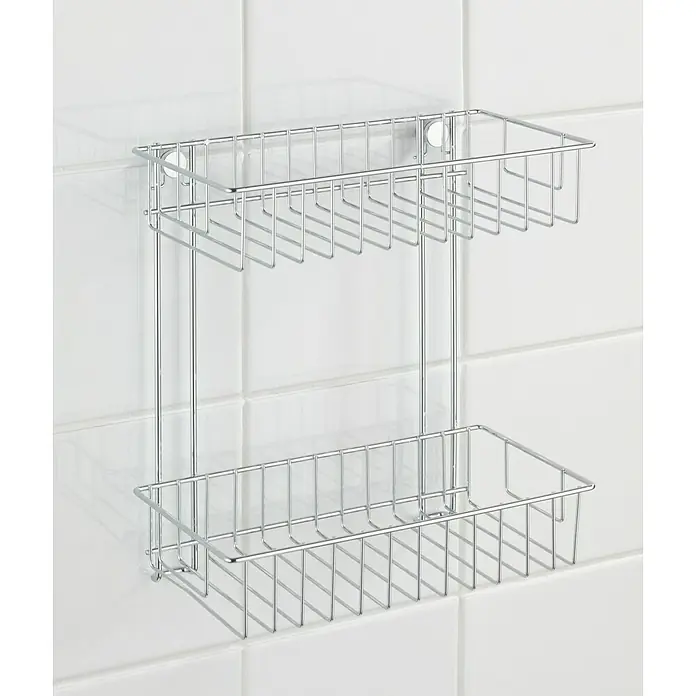 Wenko Classic Duschkorb - L x B x H: 14 x 24 x 26 cm, Chrom, Verchromt - Das Bild zeigt ein silbernes, zweistufiges Duschregal aus Metalldraht, das an einer weißen Fliesenwand befestigt ist. Praktische Badablage für Shampoo und Co.
