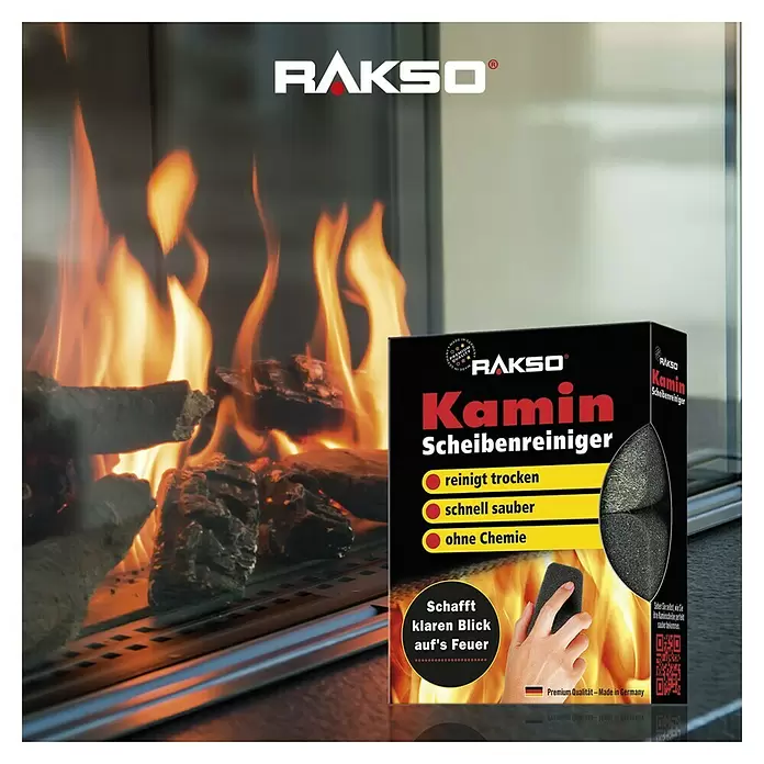 Reinigungsschwamm - 2 Stk., Schwarz - Schwarze RAKSO Kamin Scheibenreiniger Box mit Reinigungsschwamm, prominent vor einem brennenden Kamin platziert.