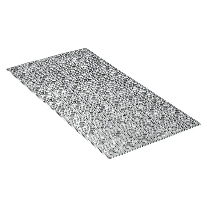 Tatay Alfombra antideslizante para ducha BCN - 36 x 72 cm, PVC, Antracita - Primer plano de un patrón de adoquín decorativo con un motivo floral en formato rectangular, ideal para espacios exteriores.