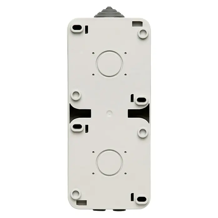 Voltomat Blueline Enchufe para estancias con humedad - x 2, Vertical, IP54, Gris - Primer plano de una caja de conexiones gris con agujeros de montaje y puntos de entrada de cables, ideal para instalaciones eléctricas.