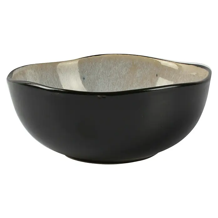 Schüssel Lunar - Ø x H: 16 x 7 cm - Nahaufnahme einer kleinen, schwarzen Schale mit cremefarbener Innenseite, ideal für Snacks oder Dips. Elegantes Design für jeden Tisch.
