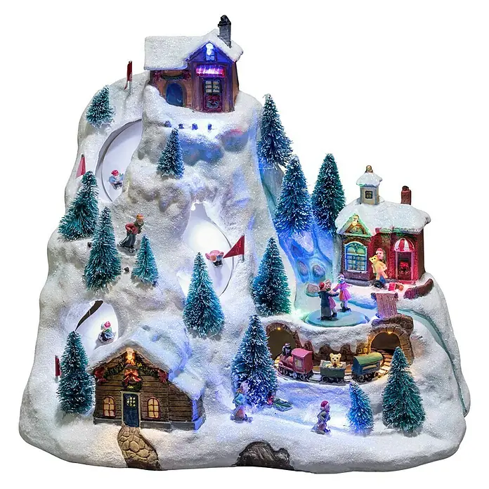 Konstsmide LED-Szenerie Skipiste - L x B x H: 31 x 20,5 x 27,5 cm, Bunt, Batteriebetrieben, LED - Verschneite Winterdorf-Dekoration mit Häusern, Bäumen, Skifahrern und einer Miniatur-Eisenbahn, die eine festliche Atmosphäre schafft.