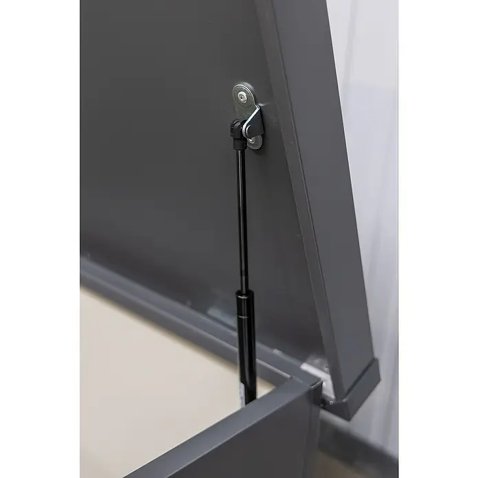 Telluria Gartenbox Nevio 160 - L x B x H: 165 x 85 x 85 cm, Stahl, Anthrazit - Detailaufnahme eines grauen Möbelstücks mit einem schwarzen Gasdruckdämpfer, der das Öffnen und Schließen erleichtert.