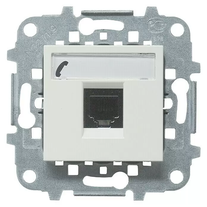 Niessen Zenit Toma de teléfono - Blanco - Toma de datos modular blanca con puerto RJ45, portaetiquetas con icono de teléfono, montada en marco metálico gris.