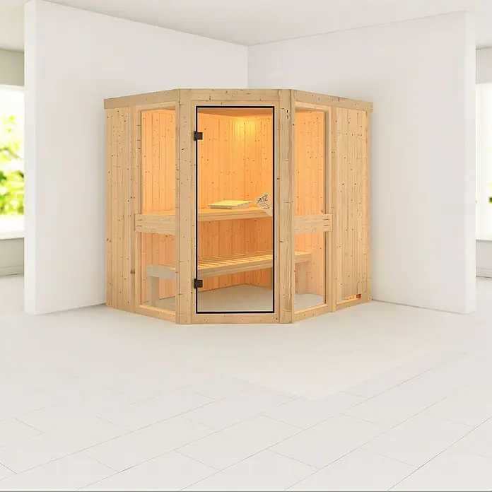 Karibu Elementsauna Amelia 1 - Ohne Ofen, Ohne Dackranz, L x B x H: 196 x 170 x 192 cm - Eine Ecksauna aus hellem Holz mit Glastür und Bänken in einem hellen Raum. Die Sauna verspricht Entspannung und Wohlbefinden.