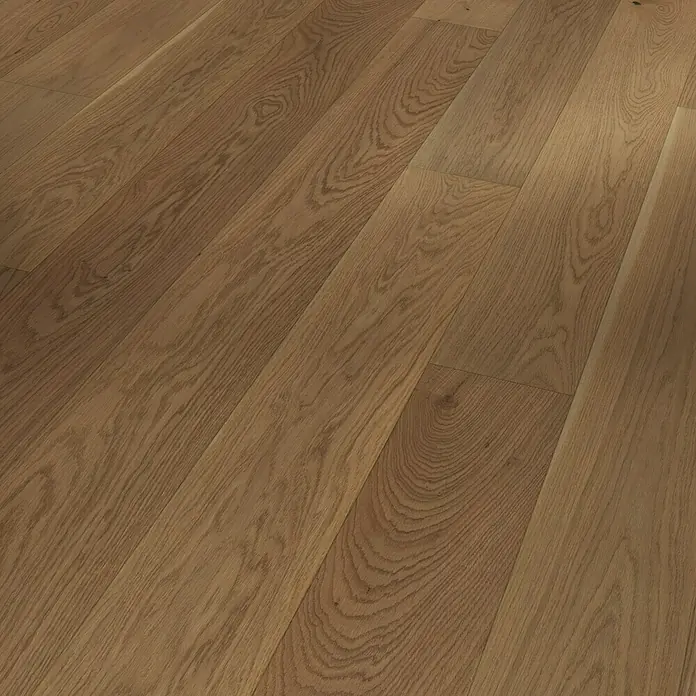 Parador Parkett Trendtime 4 - Eiche nougat, Landhausdiele, 2.010 x 160 x 13 mm - Nahaufnahme eines Fußbodens mit warmen Holzdielen, die ein natürliches Muster und eine angenehme Textur aufweisen.