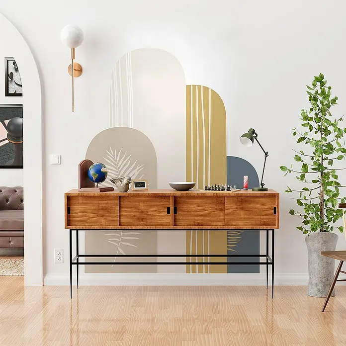 Vinilo de pared autoadhesivo Arco Eros - 132 x 170 cm, Multicolor, Plástico - Elegante aparador de madera con puertas correderas y estructura de metal negro, decorado con accesorios frente a una pared de diseño moderno.