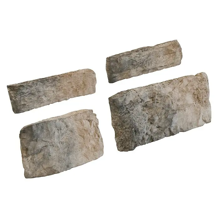 Revestimiento de piedra Silleria Plomo - Gris, Cantidad total: 4 pzs. - Primer plano de cuatro ladrillos decorativos con texturas y variaciones de color únicas, perfectos para aplicaciones arquitectónicas y de diseño.