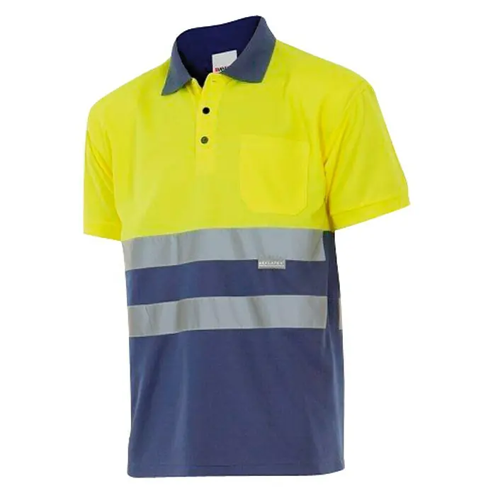 Velilla Polo de alta visibilidad manga corta - S, Amarillo/Azul - Imagen de un polo reflectante amarillo y azul de manga corta con bolsillo.