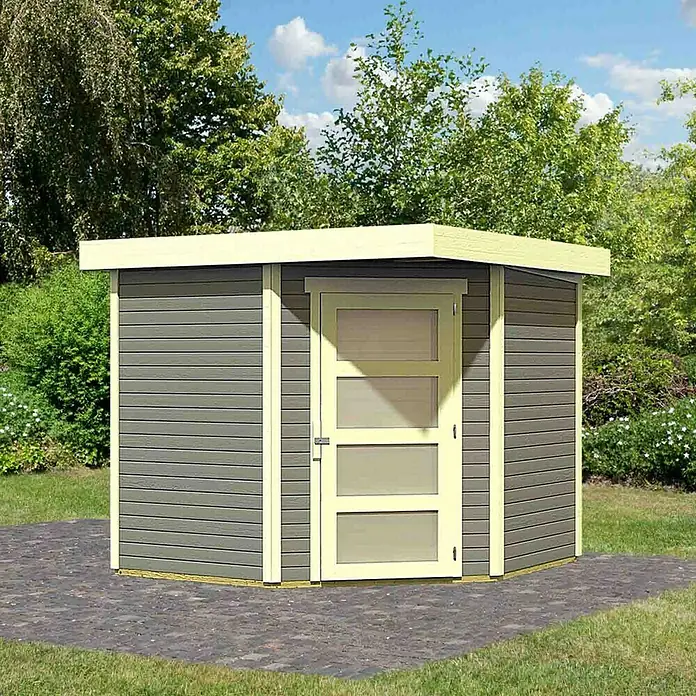 Karibu Gartenhaus Schwandorf 5 - Außenmaß inkl. Dachüberstand (B x T): 268 x 262 cm, Holz, Terragrau, Weiß - Ein graues Gartenhaus mit Flachdach und einer Tür mit drei Fenstern auf einem gepflasterten Bereich im Garten.