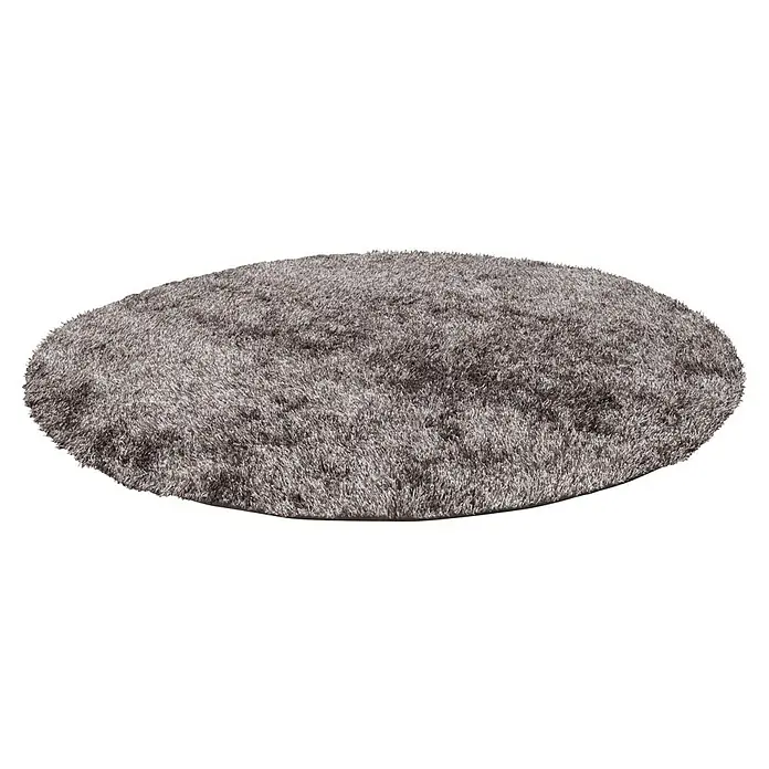 Kayoom Hochflorteppich Diamond - Champagner, Durchmesser: 160 cm, 100 % Polyester - Ein weicher, runder, zotteliger Teppich in einem gedämpften Grauton, perfekt, um jedem Raum Wärme und Textur zu verleihen. Sein langes Flor sorgt für Komfort.