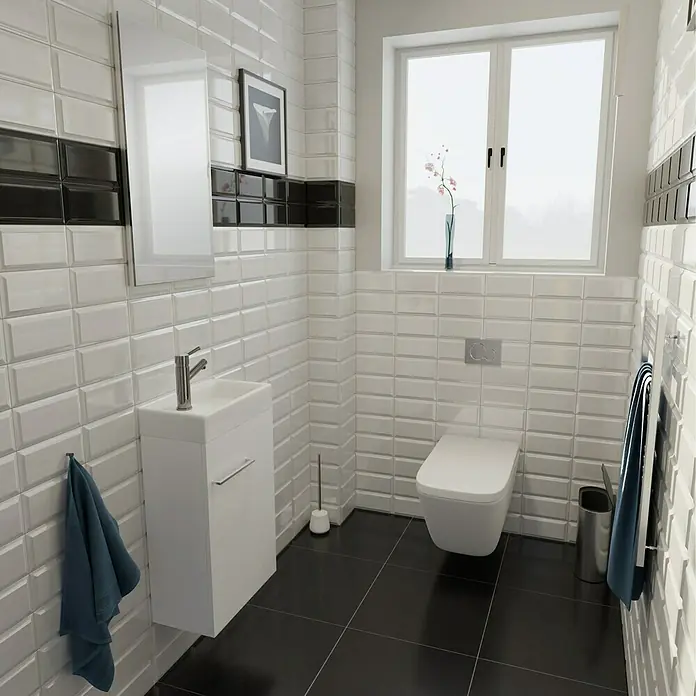 Camargue Espacio Badmöbel-Set A1 - 40 cm, Mira - Ein modernes Badezimmer mit weißen Metrofliesen, einem hängenden Waschtisch und einem WC. Die schwarzen Bodenfliesen bilden einen schönen Kontrast.
