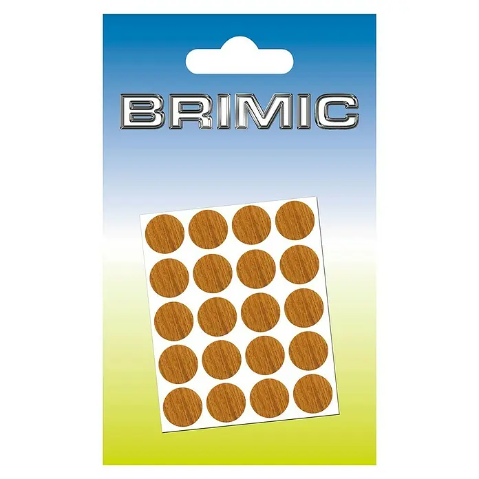 Micel Brimic Tapón embellecedor Roble oscuro - Diámetro: 13 mm, Pegado, 20 ud. - Imagen de un blíster de adhesivos de madera Brimic, ideales para tapar agujeros de tornillos. Los adhesivos tienen una bonita veta de madera.