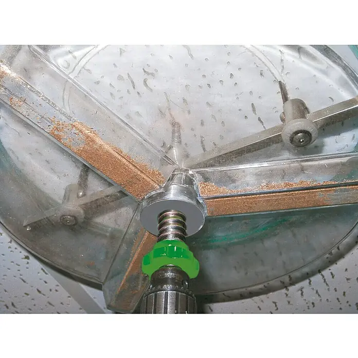 Berg Kreisschneider BHC 305 - 48 mm - 305 mm, Schnitttiefe: 30 mm (einseitig) - Nahaufnahme eines transparenten Dosiergeräts mit silbernen und grünen Elementen zur präzisen Abgabe von Materialien.