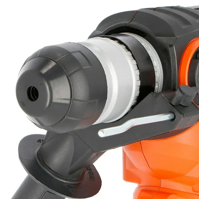 Toolson Kombihammer Pro-BH 900 - 900 W, 3 J, SDS-Plus-Aufnahme - Nahaufnahme einer Bohrmaschine mit orangefarbenem Gehäuse und schwarzem Bohrfutter, ideal für Heimwerker und professionelle Projekte.