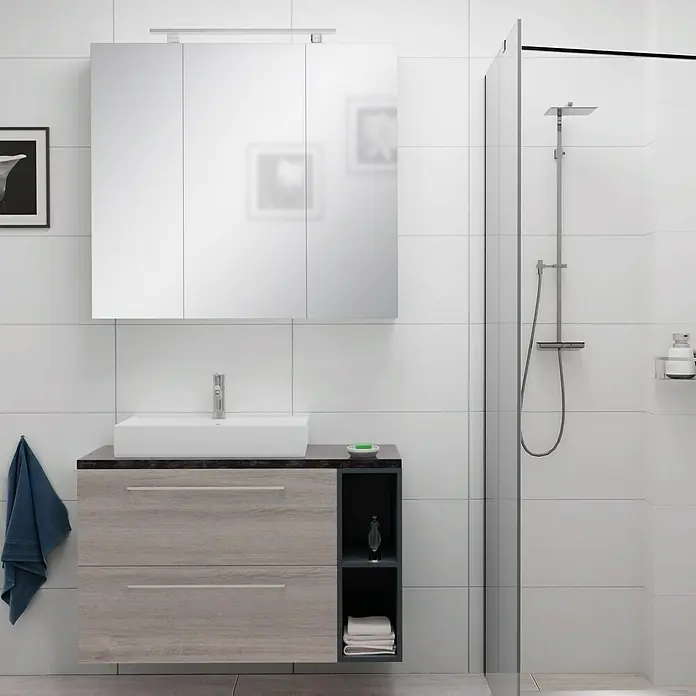 Camargue Espacio Badmöbel-Set i127 - 100 cm, Faro - Ein modernes Badezimmer-Set mit einem Waschbeckenunterschrank in Holzoptik, einem Spiegelhängeschrank und einer Duschkabine vor weißem Fliesenhintergrund.