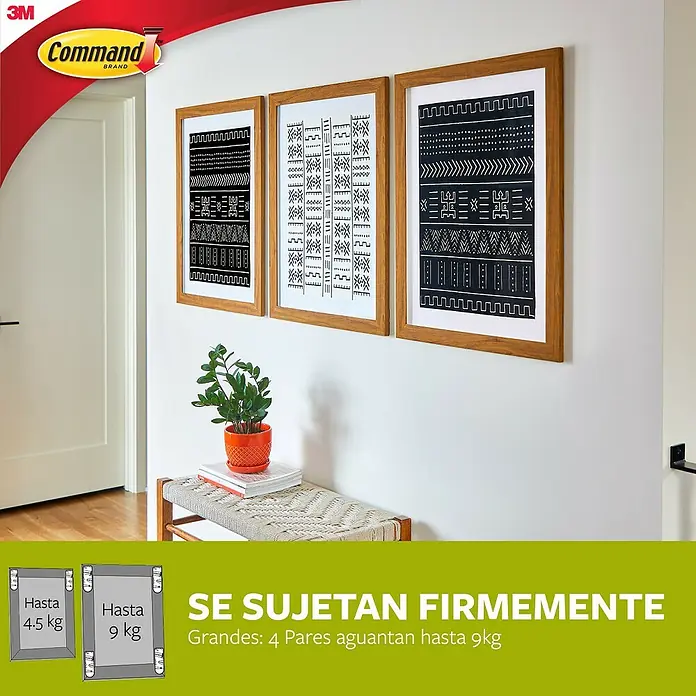 3M Command Gancho para colgar cuadros XL - Plástico, Blanco - La imagen muestra tiras para colgar cuadros Command para colgar marcos de cuadros, que pueden sujetar hasta 9 kg.