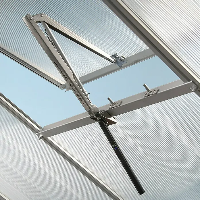 Vitavia Gewächshaus Venus 5000 Plus - Außenmaß inkl. Dachüberstand (B x T): 195 x 257 cm, 4 mm, Smaragd - Nahaufnahme eines automatischen Fensteröffners in einem Gewächshaus, der für eine gute Belüftung sorgt.
