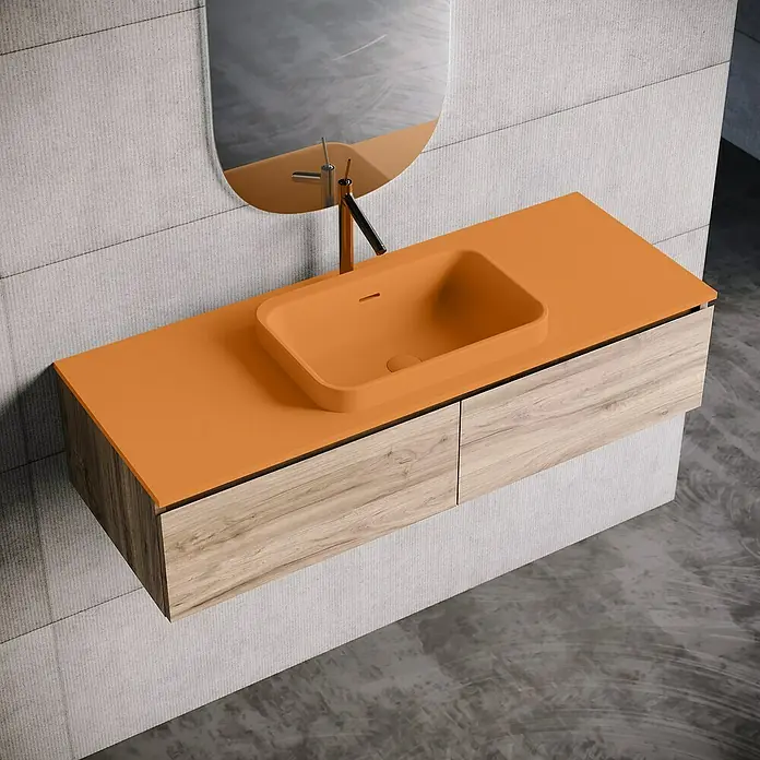 Lavabo y encimera Paul - 46 x 121 cm, Orificios para grifo: Medio, Con desbordamiento, Melocotón - Accesorio de baño moderno con un lavabo naranja y una textura de madera, que ofrece un diseño elegante y funcional.